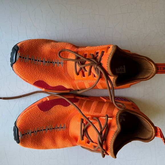 Adidas The South Park x  NMD_R1 \'Kenny\' sneakers feature a vibrant orange knit u main image 4